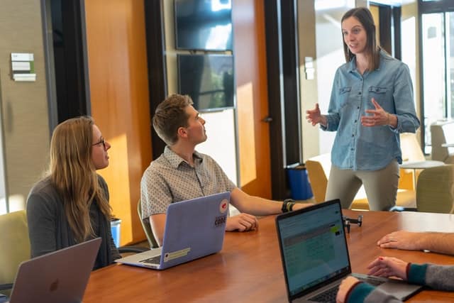 Team of business people working at a conference table working on product development