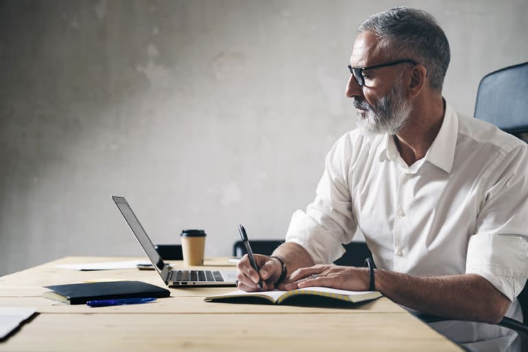 Man analyzing work at computer