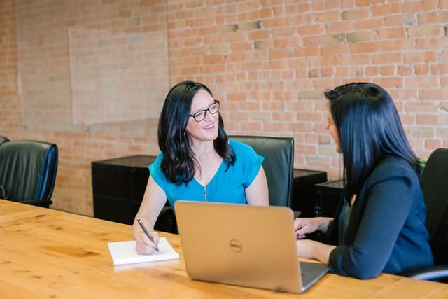 Two woman communicating with each other