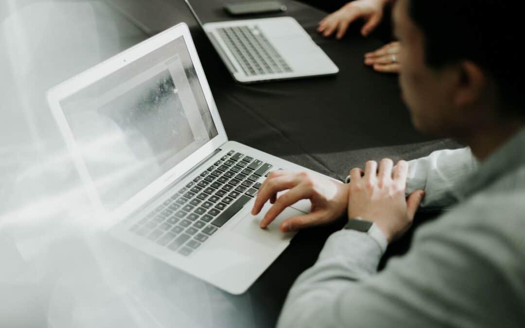 Business man working at computer doing analysis