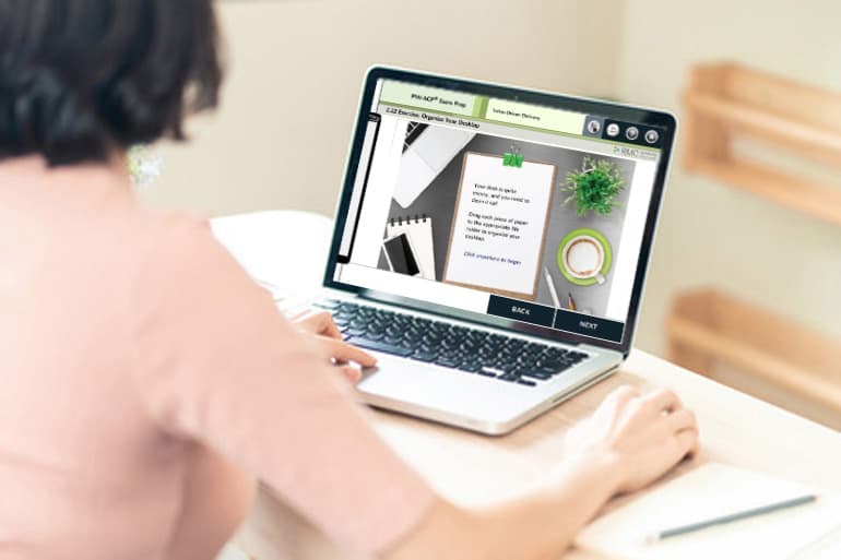 Person a desk attending an eLearning class