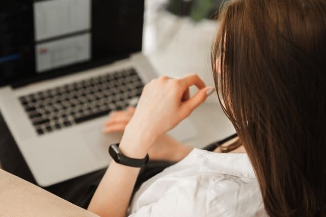 Business analyst working at her computer