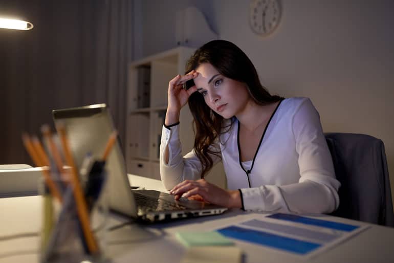 Woman at computer studying for the PMP exam