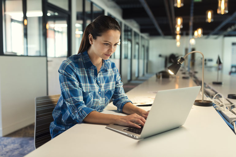 Woman working on project management compliance process